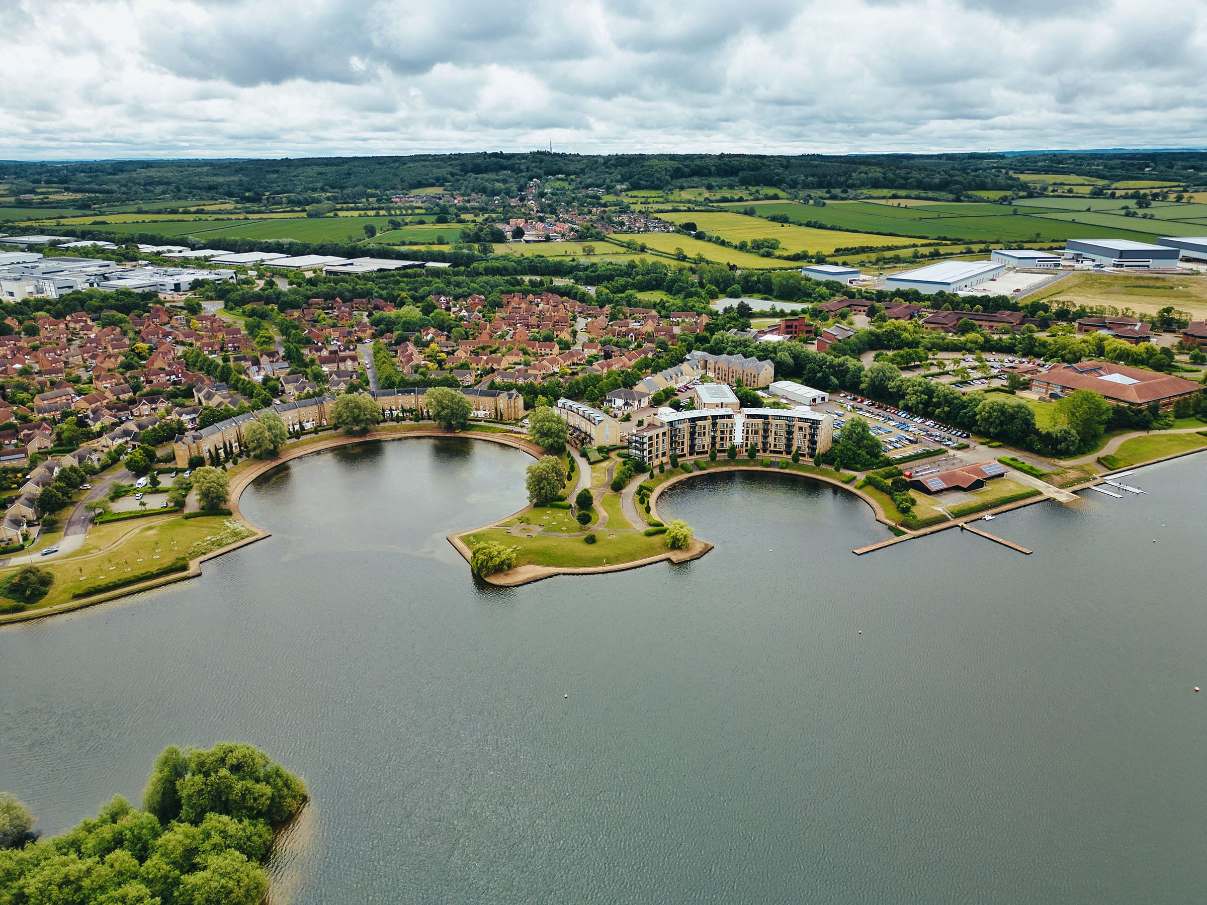 Aerial view of lakeside housing and countryside